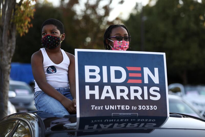 Supporters watch as U.S. Democratic vice presidential nominee Senator Kamala Harris (D-CA) speaks at a campaign event at Morehouse College in Atlanta, Georgia, U.S. REUTERS