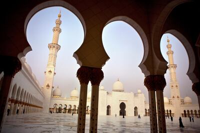 Sheikh Zayed Grand Mosque bathes in the light of a sunset and later lights up to continue provide a beautiful and peaceful solace to the faithful as well as the curious tourists on Tuesday evening, July 18, 2011.  (Silvia Razgova/The National)

