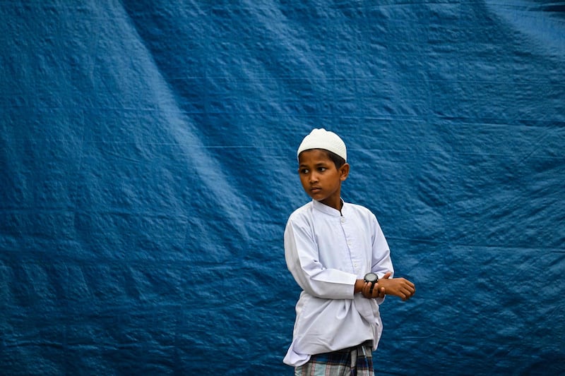 A Rohingya refugee child attends Eid prayers at a shelter in Meulaboh, Indonesia. AFP