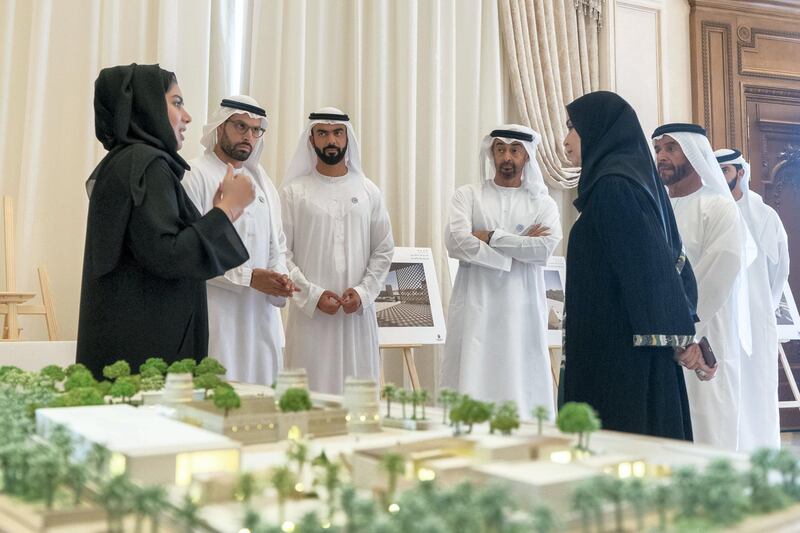 ABU DHABI, UNITED ARAB EMIRATES - October 29, 2018: HH Sheikh Mohamed bin Zayed Al Nahyan Crown Prince of Abu Dhabi Deputy Supreme Commander of the UAE Armed Forces (4th L), views designs of the new Al Ain Museum, during a Sea Palace barza.��Seen with HE Mohamed Khalifa Al Mubarak, Chairman of the Department of Culture and Tourism and Abu Dhabi Executive Council Member (2nd L), HE Saif Ghobash, Director General of Abu Dhabi Tourism and Culture Authority (3rd L)., HE Dr Amal Abdullah Al Qubaisi, Speaker of the Federal National Council (FNC) (R) and HH Sheikh Saif bin Mohamed Al Nahyan (2nd R). 

(�� / Crown Prince Court - Abu Dhabi )
---