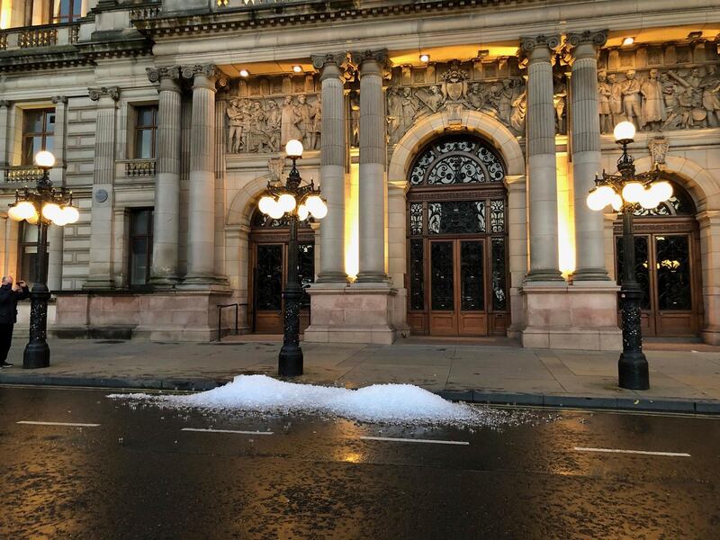 Left over ice dumped on the street in Glasgow in a protest by hospitality workers, as temporary restrictions announced by First Minister Nicola Sturgeon come into effect from 6pm, Scotland.  AP