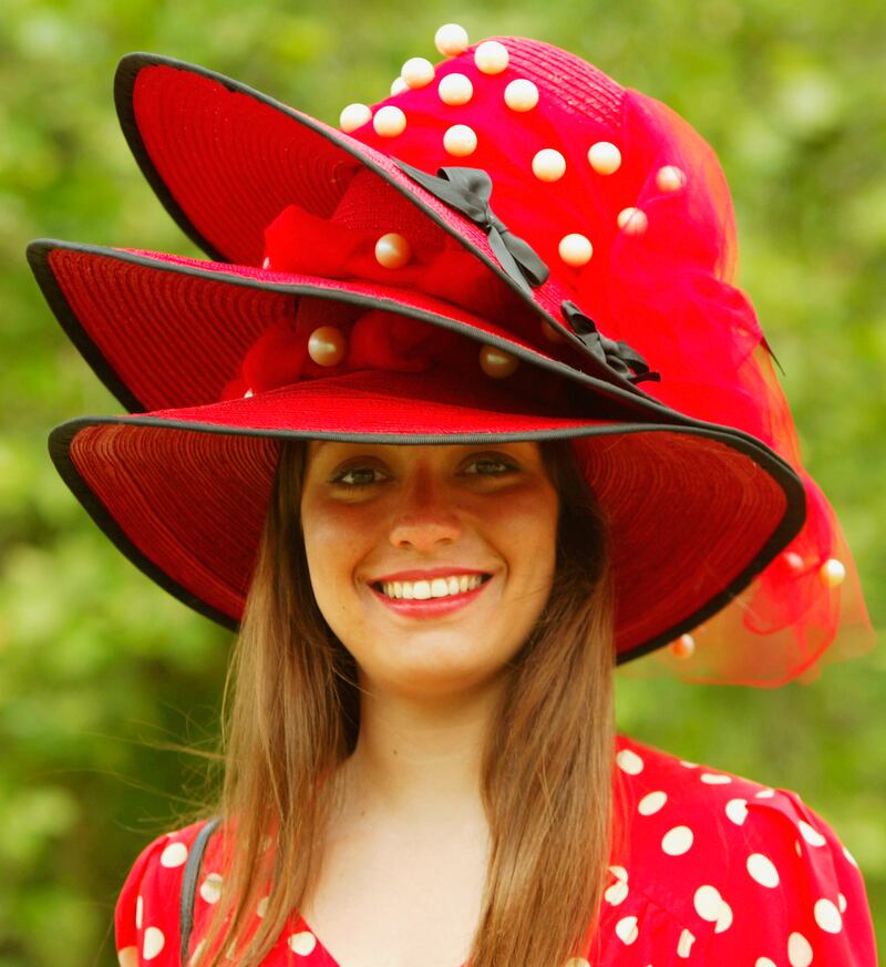 Alice Ascoli attends Ladies Day in a hat made of three hats in 2004. Getty Images
