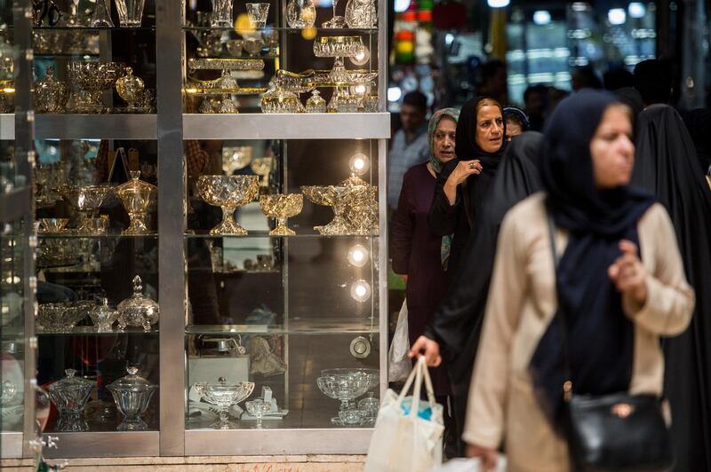 Women pass a store display of glassware while shopping in the Grand Bazaar in Tehran, Iran, on Monday, Aug. 6, 2018. Iran’s central bank, acting on the eve of U.S. sanctions, scrapped most currency controls introduced this year in a bid to halt a plunge in the rial that has stirred protests against the government of President Hassan Rouhani. Photographer: Ali Mohammadi/Bloomberg