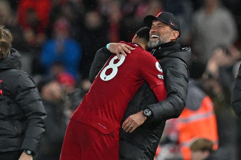 Liverpool manager Jurgen Klopp greets striker Cody Gakpo. AFP