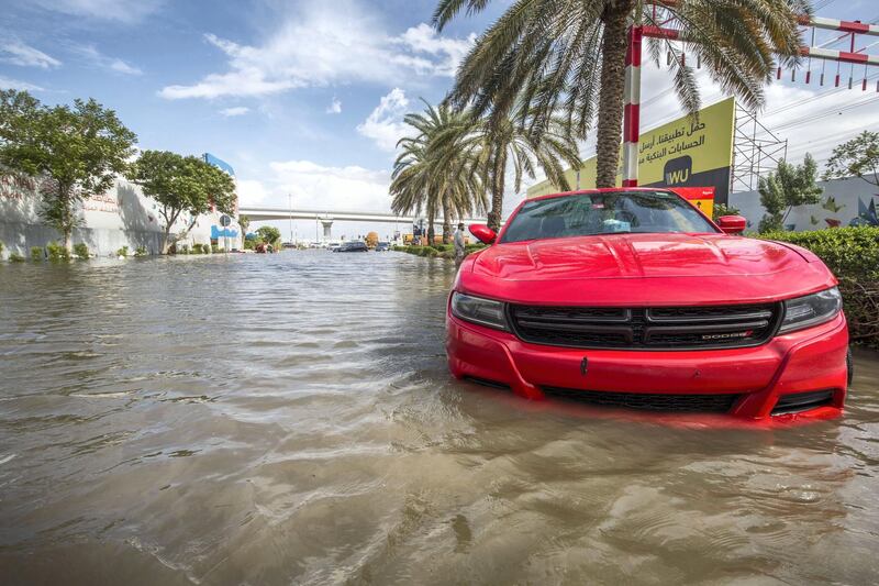 Dubai, United Arab Emirates - Abandoned cars at the road crossing the Batuta area and Discovery Gardens due to heavy rains yesterday.  Ruel Pableo for The National