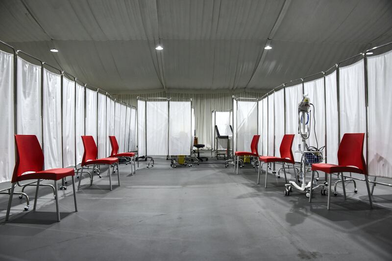 Beirut, Lebanon, 13 February, 2021. Socially distanced chairs line one of eight bays at a new vaccine center set up at St George's hospital, on the eve of Lebanon's Covid-19 vaccine roll-out. Lebanon is preparing to receive its first, Pfizer-Biontech Covid-19 vaccines.