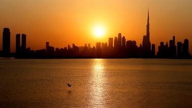 A picture taken on February 14, 2022 shows a general view of the skyline of downtown Dubai with Burj Khalifa at sunset, in the Gulf emirate of Dubai, on February 14, 2022. (Photo by Giuseppe CACACE / AFP)