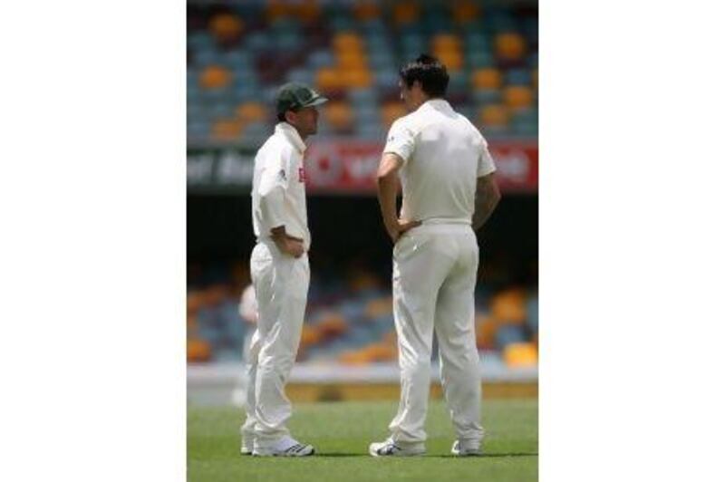 Ricky Ponting, left, talks to Mitchell Johnson during the first Test. Johnson is likely to be axed for the second Test. Tom Shaw / Getty Images