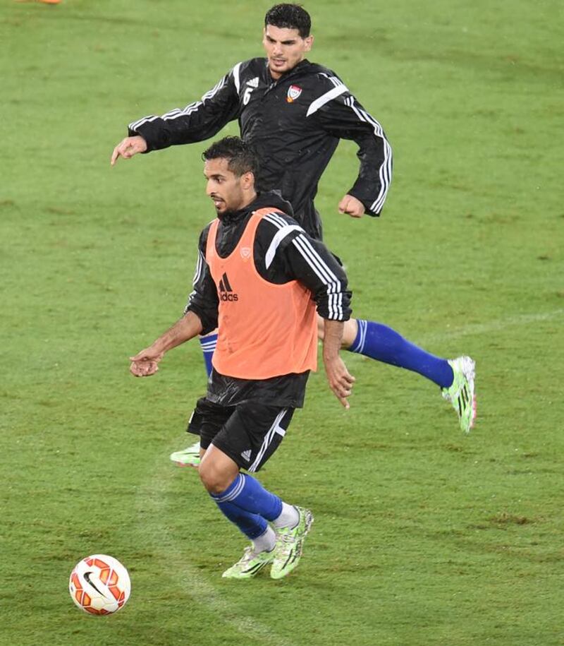 Ali Mabkhout (front) is chased by Mohanad Salem during a UAE national football team training session at Robina Stadium, Gold Coast, Australia. December 28 2014. Photo Courtesy: UAE FA