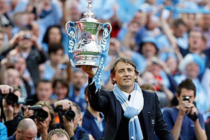 Mancini celebrates the spoils for his hard work.