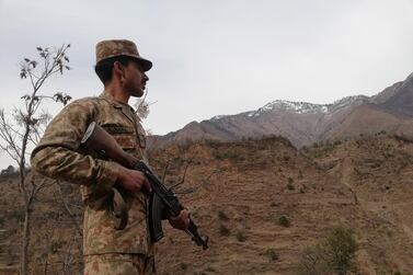 A Pakistani soldier stands guard at the Line of Control, the de facto border between Pakistani and Indian administered Kashmir. EPA