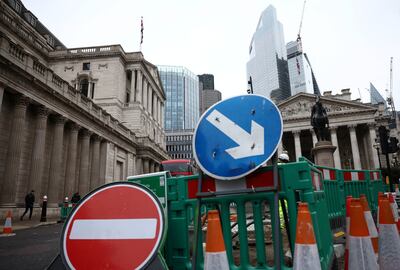 Road signs outside the Bank of England in London. The IMF has signalled a 0.6 per cent contraction for the UK economy in 2023. Reuters