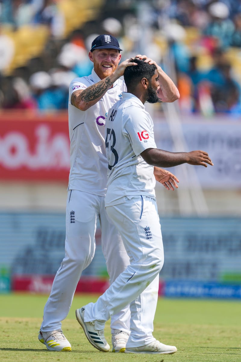 England's captain Ben Stokes congratulates Rehan Ahmed on taking the wicket of India's Ravichandran Ashwin. AP