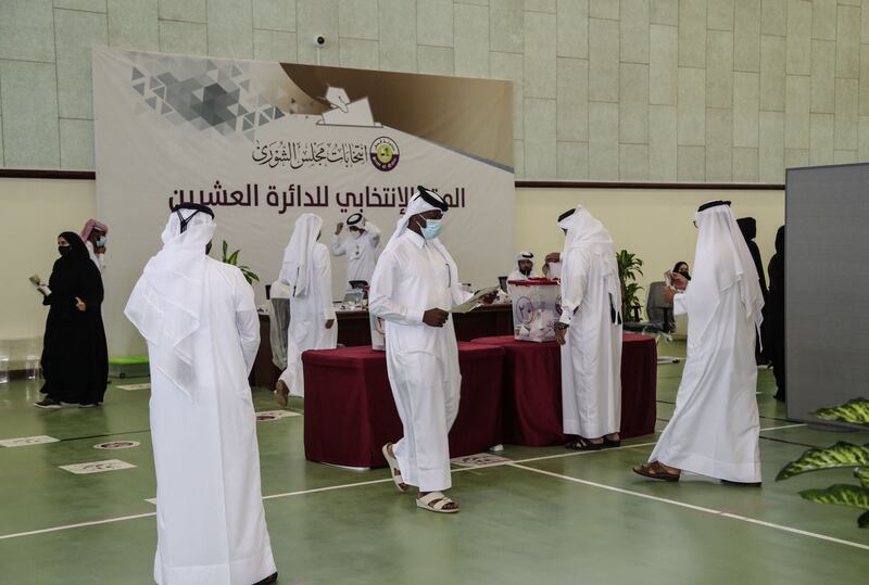 Qatari men cast their ballots at a polling station in Al Khor. AFP