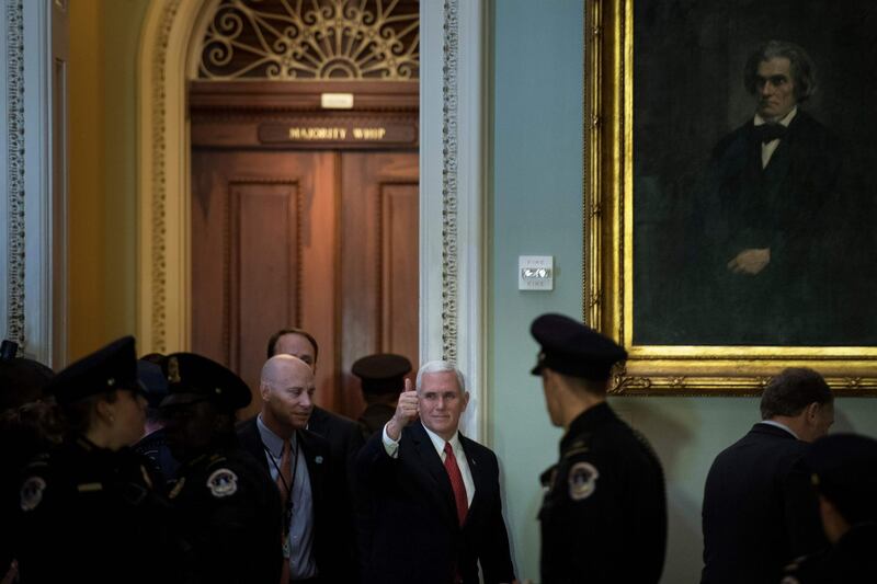 TOPSHOT - US Vice President Mike Pence arrives for a luncheon with Senate Republicans as lawmakers continue to work for tax reform legislation on Capitol Hill December 19, 2017 in Washington, DC. / AFP PHOTO / Brendan Smialowski