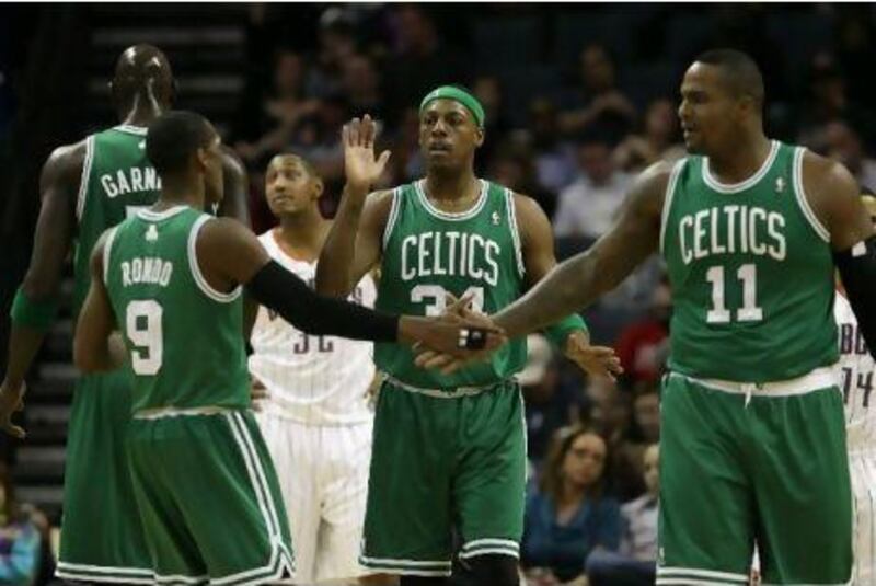 Paul Pierce, centre with Rajesh Rondo, left, and Glen Davis, right, is one of a number of players in the Boston Celtics side, who lead the Eastern Conference, over the age of 30. Streeter Lecka / Getty Images