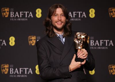 Ludwig Goransson with his award for Original Score for Oppenheimer during the 2024 Bafta awards in London. Reuters