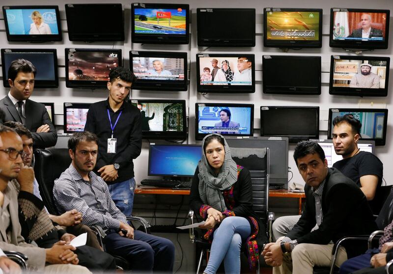 Afghan journalists attend a meeting in the Tolo newsroom, in Kabul, Afghanistan. Reuters