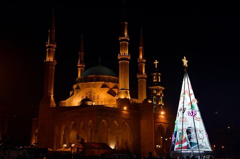 A view of an illuminated Christmas tree made from protest banners by Lebanese anti-government demonstrators at Martyrs Square in Beirut.  EPA