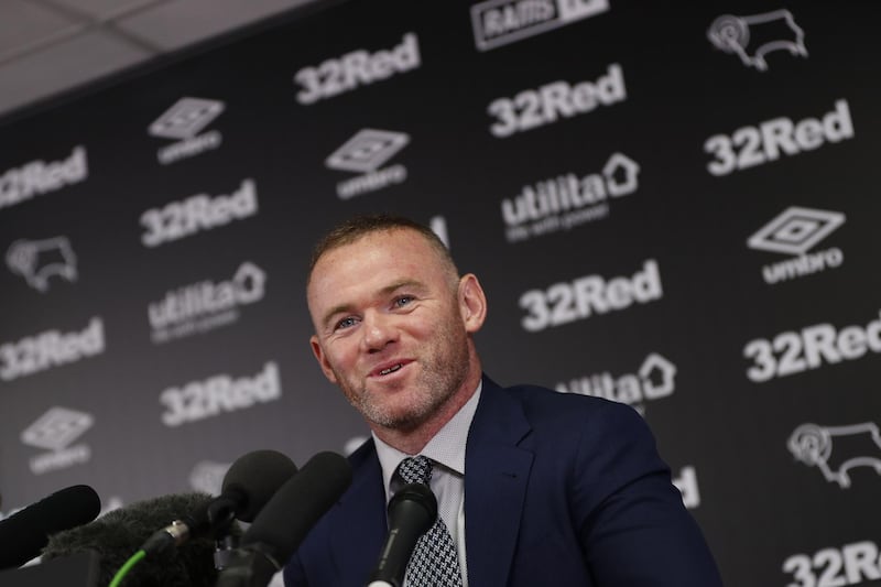 Wayne Rooney speaks during a press conference at Pride Park Stadium in Derby on August 6, 2019 after he agreed a deal to become a player-coach. AFP
