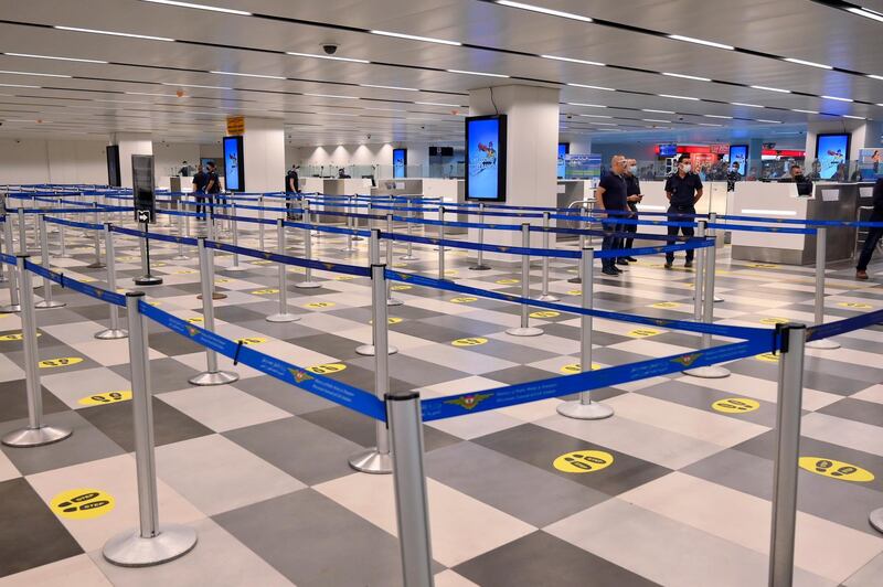 Social distancing markings have been established in the arrival hall of the Rafik Hariri international airport during its re-opening in Beirut. EPA