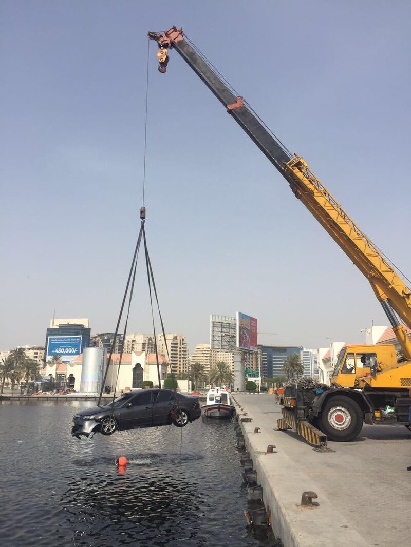 A car is pulled out of Dubai Creek. Courtesy Dubai Police