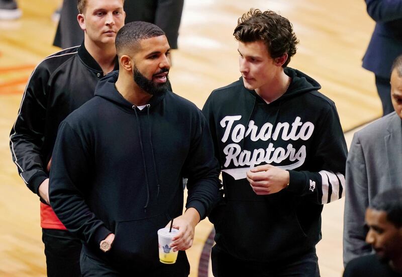 Drake, left, with fellow musician Shawn Mendes. Reuters