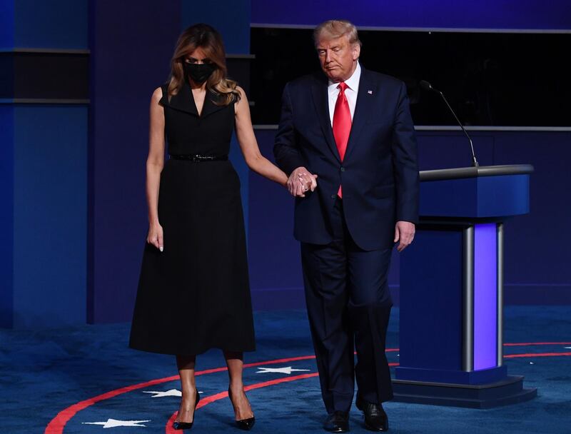 US President Donald Trump, right, and US First Lady Melania Trump exit after the presidential debate. Bloomberg