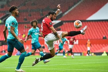 Manchester United's Portuguese midfielder Bruno Fernandes controls the ball during the English Premier League football match between Manchester United and Bournemouth at Old Trafford in Manchester, north west England, on July 4, 2020. RESTRICTED TO EDITORIAL USE. No use with unauthorized audio, video, data, fixture lists, club/league logos or 'live' services. Online in-match use limited to 120 images. An additional 40 images may be used in extra time. No video emulation. Social media in-match use limited to 120 images. An additional 40 images may be used in extra time. No use in betting publications, games or single club/league/player publications. / AFP / POOL / PETER POWELL / RESTRICTED TO EDITORIAL USE. No use with unauthorized audio, video, data, fixture lists, club/league logos or 'live' services. Online in-match use limited to 120 images. An additional 40 images may be used in extra time. No video emulation. Social media in-match use limited to 120 images. An additional 40 images may be used in extra time. No use in betting publications, games or single club/league/player publications.