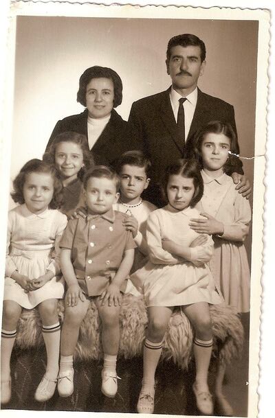 The youngest of six children - including two sets of twins born on the same day a year apart - Father Nadim (centre front in 1968) says his opinion was always as valid as everyone's in the family. Photo: Nadim Nassar