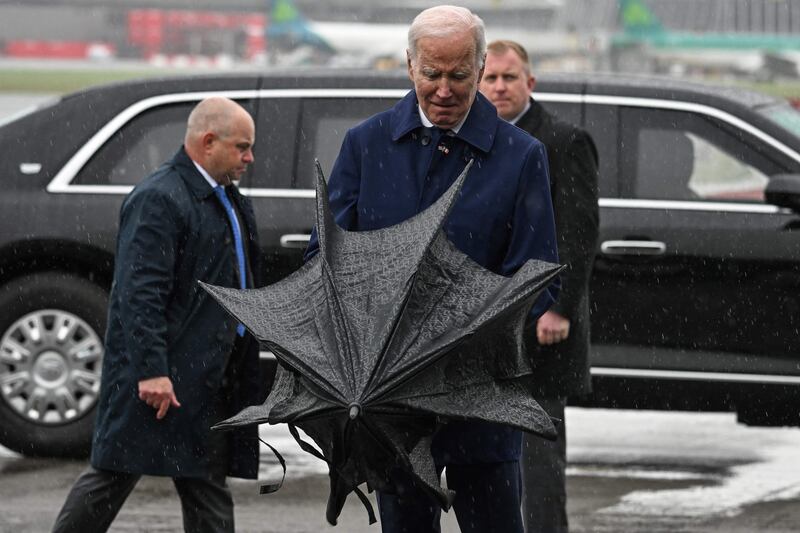 Mr Biden encountered some inclement weather on his arrival at Dublin. AFP