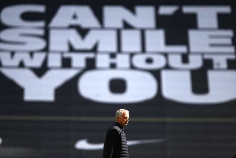 Tottenham Hotspur's Portuguese head coach Jose Mourinho walks on the pitch before the English Premier League football match between Tottenham Hotspur and Arsenal at Tottenham Hotspur Stadium in London, on July 12, 2020. (Photo by Julian Finney / POOL / AFP) / RESTRICTED TO EDITORIAL USE. No use with unauthorized audio, video, data, fixture lists, club/league logos or 'live' services. Online in-match use limited to 120 images. An additional 40 images may be used in extra time. No video emulation. Social media in-match use limited to 120 images. An additional 40 images may be used in extra time. No use in betting publications, games or single club/league/player publications. / 