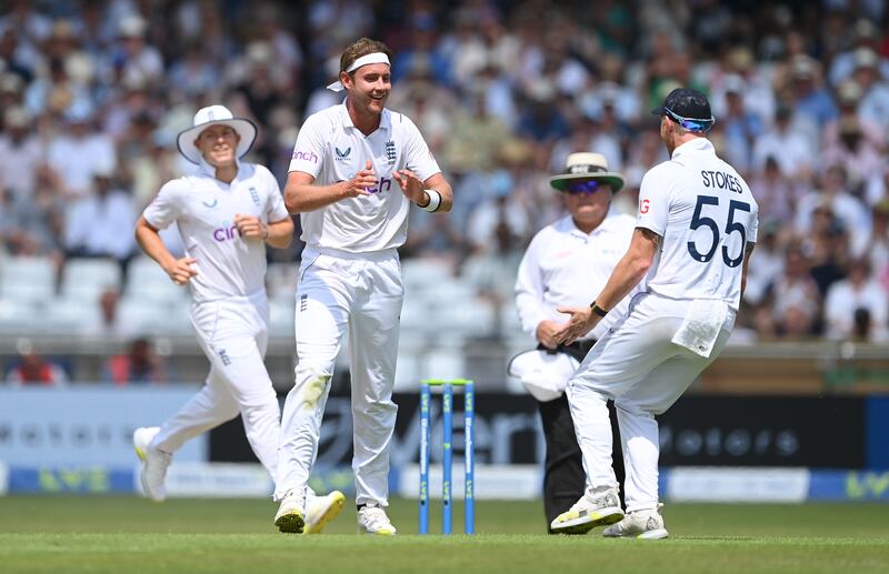 England bowler Stuart Broad celebrates with captain Ben Stokes after taking the wicket of Kane Williamson. Getty