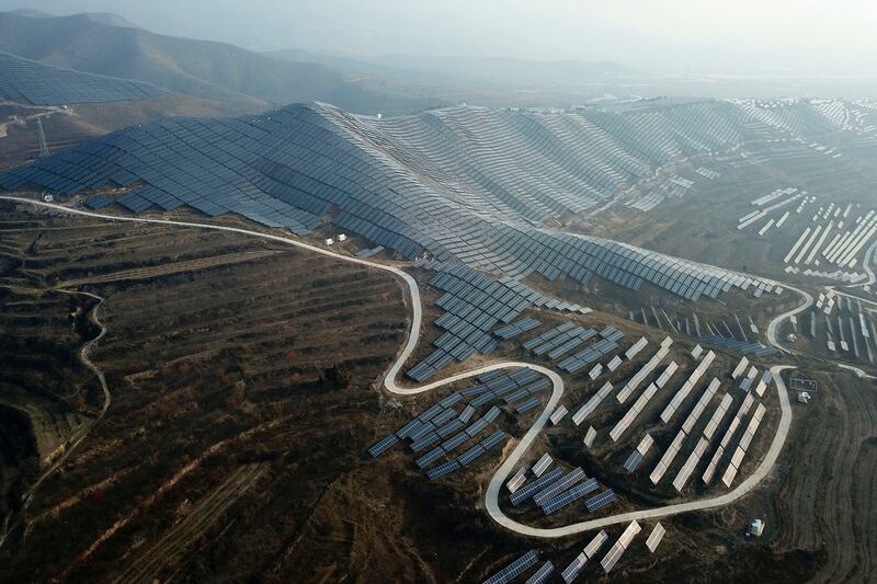 A solar power plant in China's Shanxi Province. China will drive the renewable capacity growth over the coming years, accounting for 43 per cent of global renewable capacity growth, the IEA has said. AP