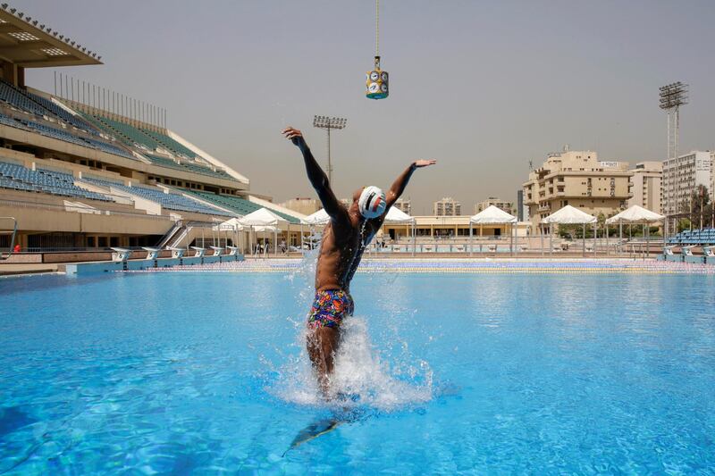 Egyptian swimmer, Omar Sayed Shaaban, 21, who has broken the record for the highest out-of-water jump while wearing a monofin, trains with his monofin at Cairo Stadium Swimming Pools, Egypt, March 20, 2021. Picture taken March 20, 2021. REUTERS/Hayam Adel