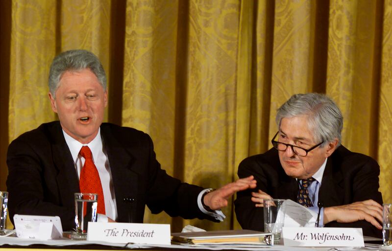 Former US president Bill Clinton introduces Wolfensohn during the Conference on the New Economy in the East Room of the White House on April 5, 2000. Getty Images