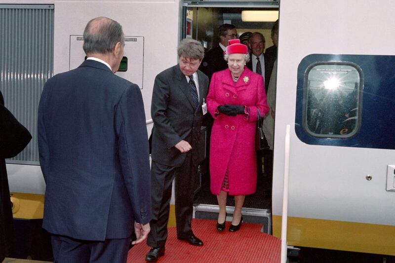 French president François Mitterrand, foregound, welcomes Queen Elizabeth II during the inauguration of the Channel Tunnel on May 6, 1994. Jacques Demarthon / AFP