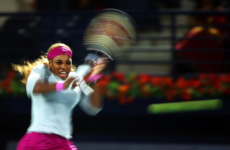 Serena Williams of the USA returns the ball to Jelena Jankovic of Serbia during their quarter-final match of the Dubai Duty Free Tennis Championships on February 20, 2014. Ali Haider / EPA