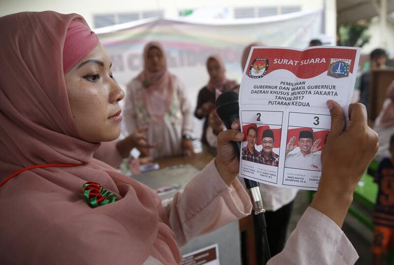 Election workers count ballots at a polling station in Jakarta, Indonesia, 19 April 2017 as Indonesians vote in a local election for Jakarta's governor after a bitter campaign with religious tensions following the blasphemy trial involving the incumbent governor Basuki 'Ahok' Tjahaja Purnama. Adi Weda/EPA
