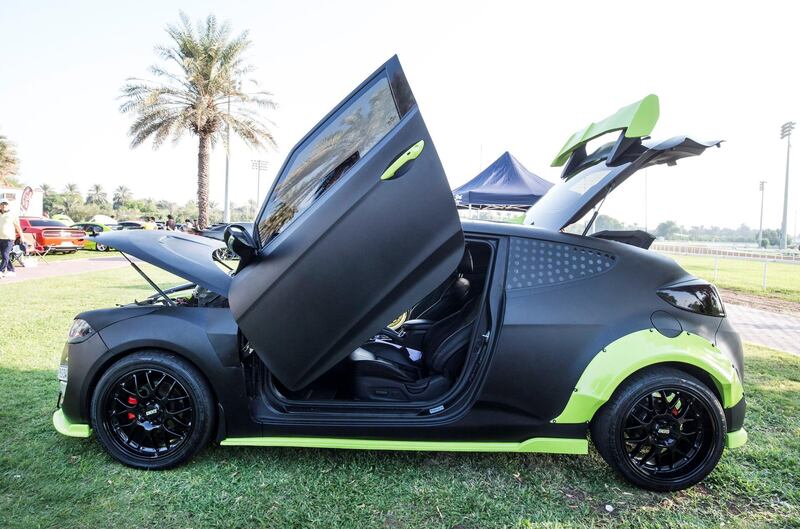 ABU DHABI, UNITED ARAB EMIRATES, 28 OCTOBER 2018 - A Veloster black and green 2015 model owned by Abdul Rehman at the Street Meet modified cars event, Abu Dhabi City Golf Club.  Leslie Pableo for The National for Adam Workman's story