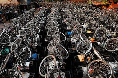 TOPSHOT - Parked bicycles used to transport materials in a wholesale market are pictured during a government-imposed nationwide lockdown as a preventive measure against the COVID-19 coronavirus, in Kolkata on  April 6, 2020. / AFP / Dibyangshu SARKAR
