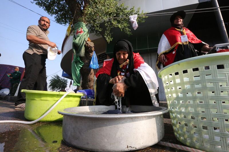 Iraqi women volunteer to wash the clothes of protesters by hand during continuing protests in central Baghdad against corruption, unemployment and appalling public services. AFP