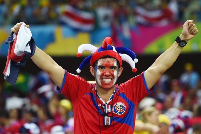 A Costa Rica fan celebrates their shock win. Jamie McDonald / Getty Images