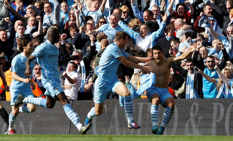 Manchester City's Sergio Aguero, right, celebrates his league-winning goal against Queens Park Rangers at the Etihad Stadium on May 13, 2012. Reuters