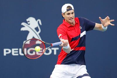 Mar 27, 2019; Miami Gardens, FL, USA; John Isner of the United States hits a forehand against Roberto Bautista Agut of Spain (not pictured) in a mens singles quarterfinal in the Miami Open at Miami Open Tennis Complex. Mandatory Credit: Geoff Burke-USA TODAY Sports