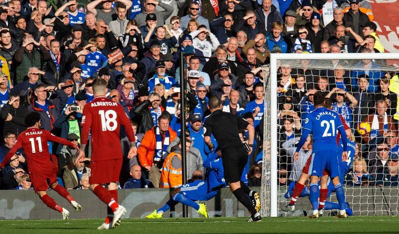 Liverpool's Mohamed Salah scores the opening goal against Cardiff City. A second-half Sadio Mane double and a strike from substitute Xherdan Shaqiri sent Liverpool on their way to a 4-1 win at Anfield. AFP
