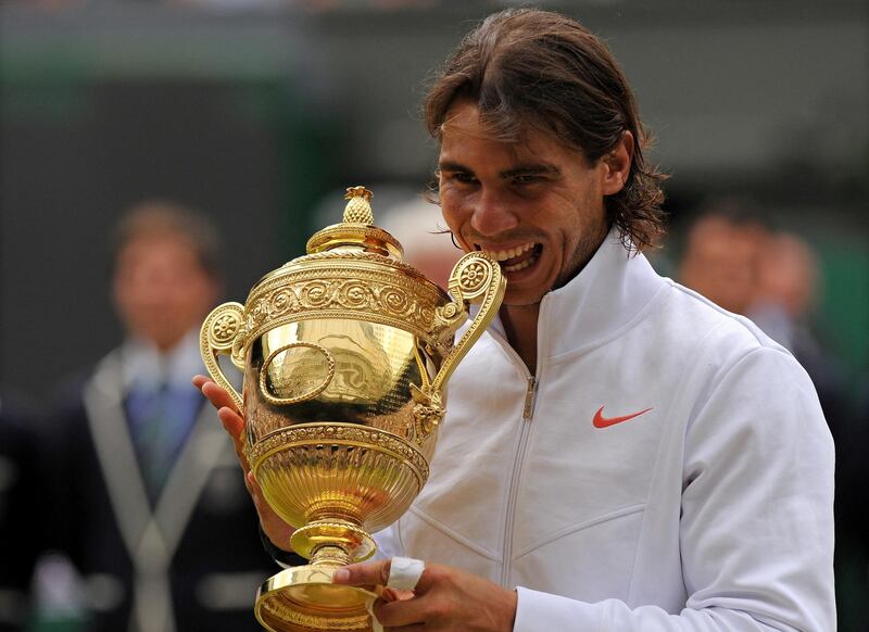 Spain's Rafael Nadal holds the Wimbledon Trophy after beating Czech Republic's Tomas Berdych 6-3, 7-5, 6-4, in the Men's Singles Final at the Wimbledon Tennis Championships at the All England Tennis Club, in south-west London, on July 4, 2010. AFP PHOTO/ADRIAN DENNIS (Photo by ADRIAN DENNIS / AFP)