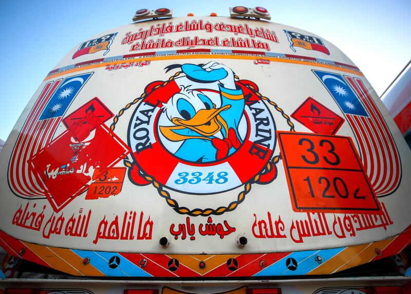 Colourful stickers decorate an aid lorry at the Rafah crossing