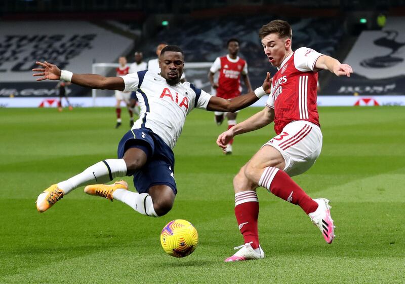 Arsenal's Kieran Tierney and Tottenham Hotspur's Serge Aurier battle for the ball. PA
