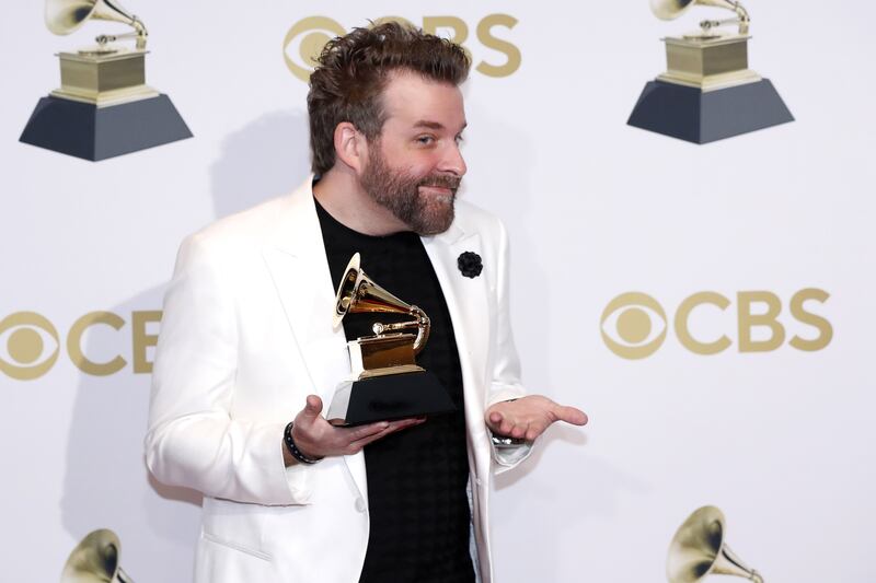 Taylor Eigsti pose in the press room with his Grammy for Best Contemporary Instrumental Album for 'Tree Falls,' during the 64th annual Grammy Awards. EPA